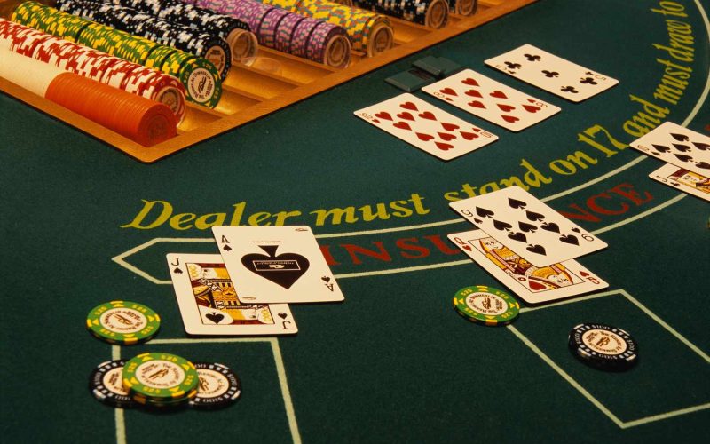 winning-blackjack-hand-on-casino-table-520257696-58979c263df78caebc19a6e7